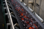 Heat resistant conveyor belt for transporting hot clinker, slag, coke, sinter, fly ash, and foundry sand in cement and steel industries.